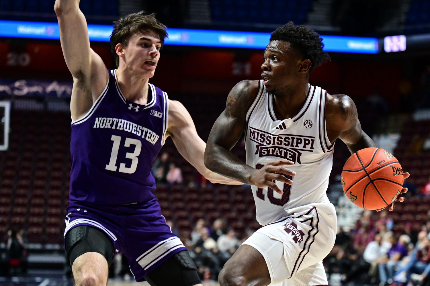 Mississippi State Bulldogs guard Josh Hubbard (13) looks to shoot the ball defended by Northwestern Wildcats guard Brooks Barnhizer (13) during the second half at Mohegan Sun Arena.
